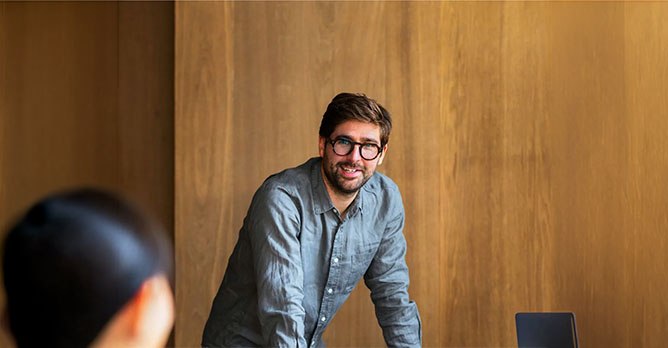 Smiling man in a casual shirt, a dedicated Solance account director